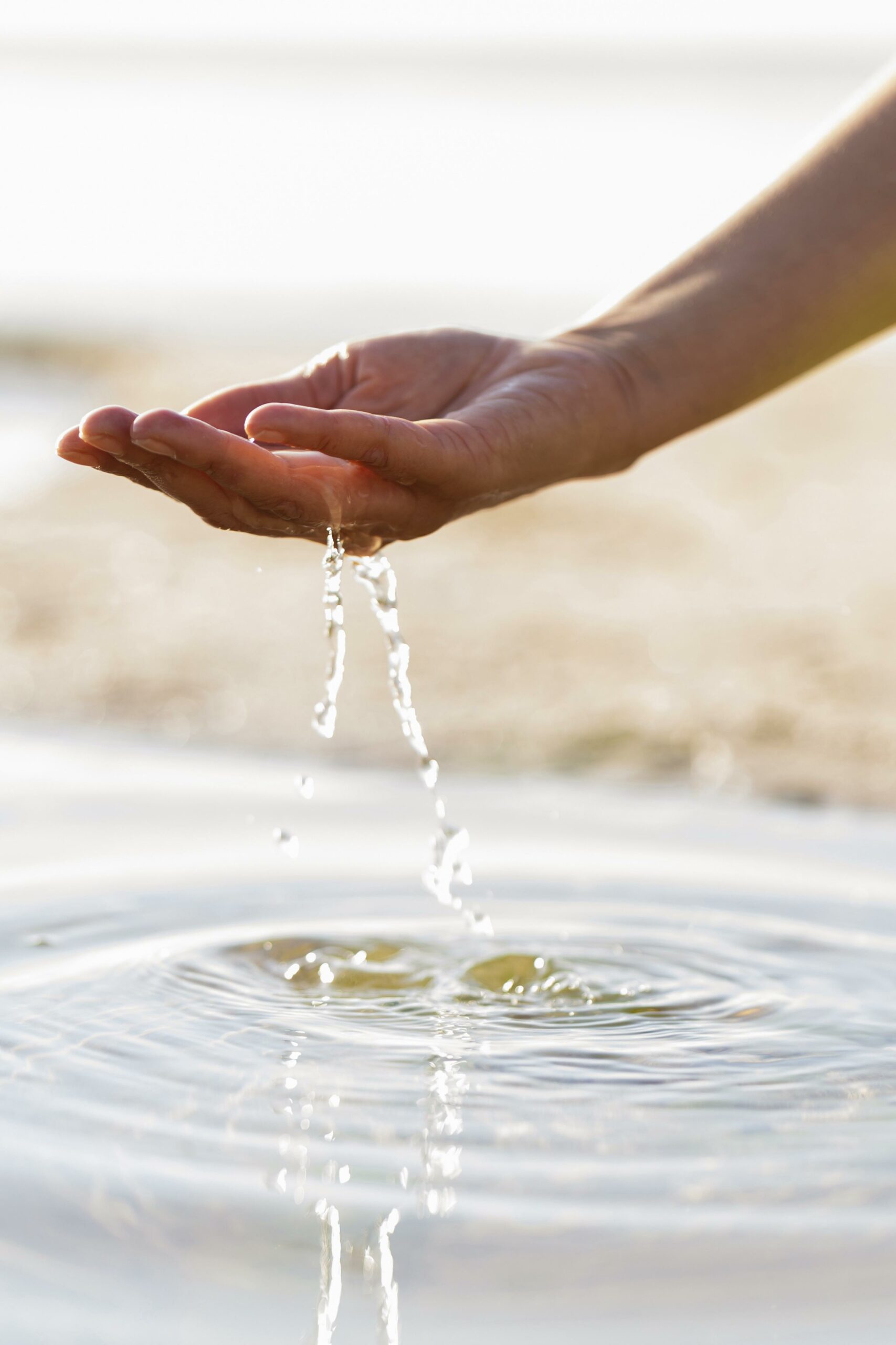 woman-holding-clear-water-her-hand